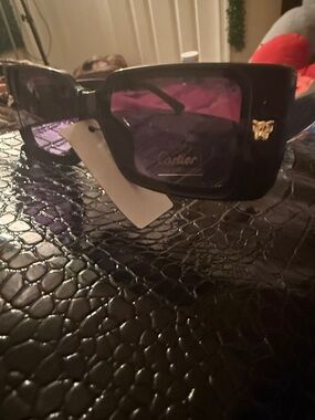 Women’s Black Frame Sunglasses with Purple Lenses and Gold Detail